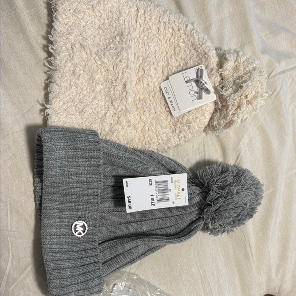 Michael Kors Gray Pom-Pom Beanie and Lemon cream colored beanie